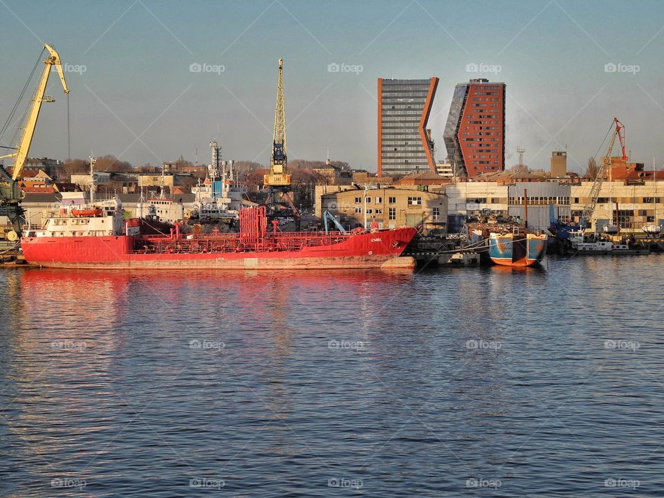 Red boat in a port.