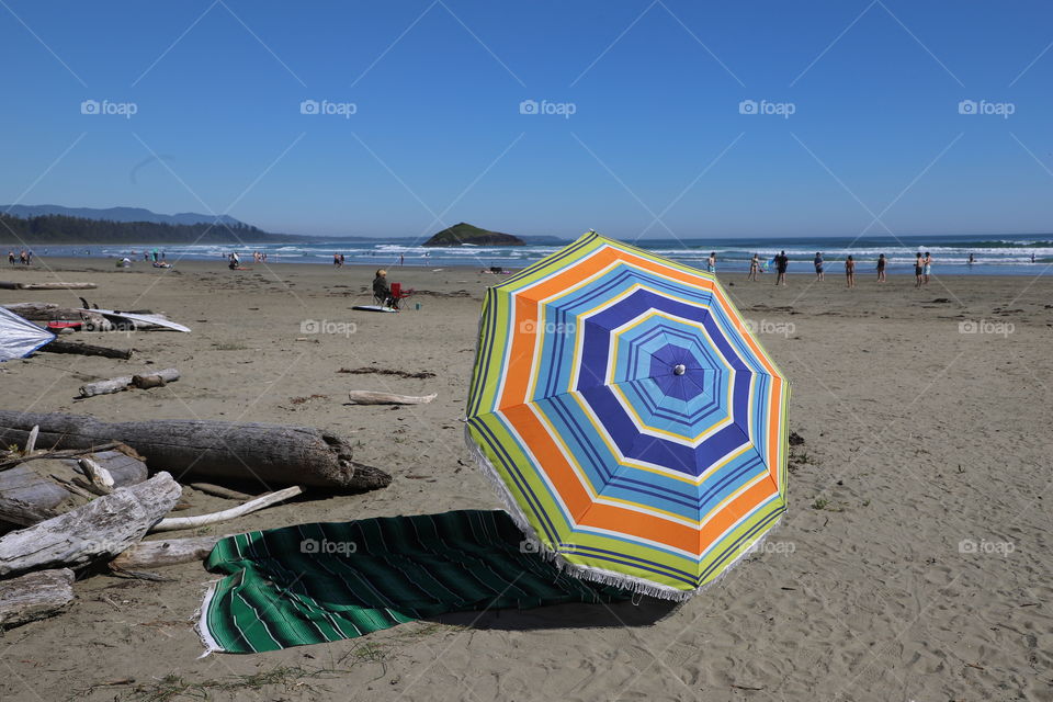 Rag and umbrella on a sunny beach