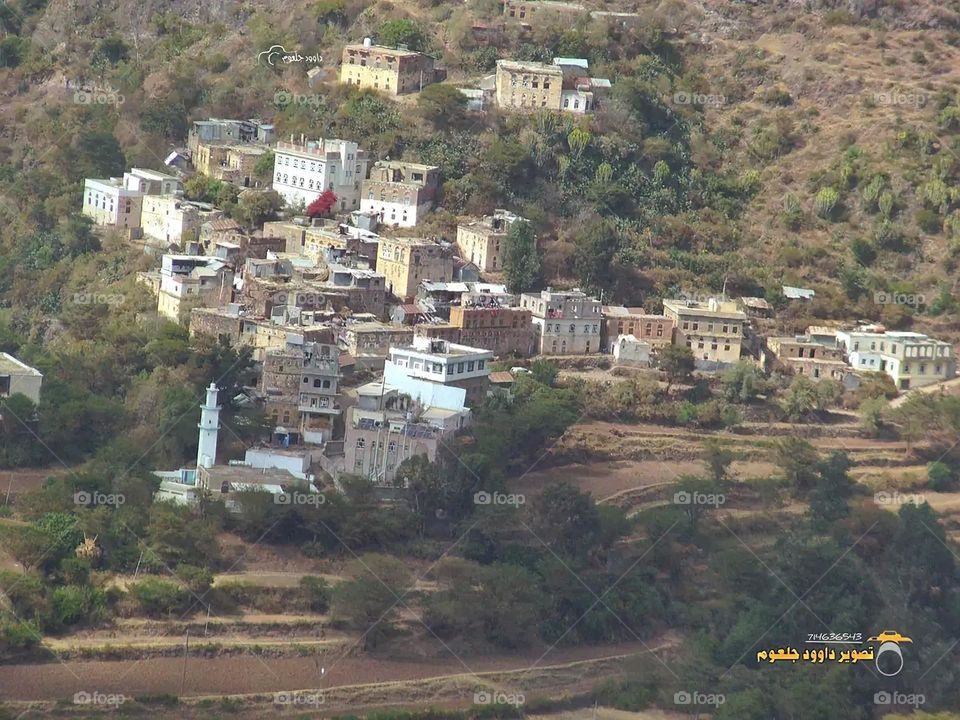 A stunning view of green mountains covered in fog in Yemen