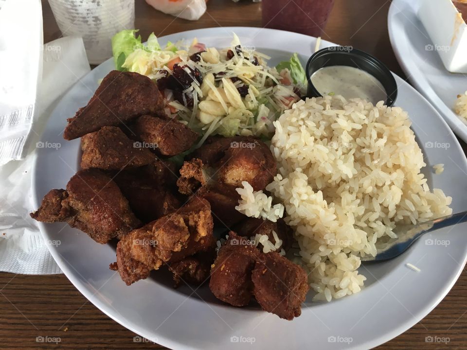 A delicious plate of rice and meat at restraunt in Puerto Rico