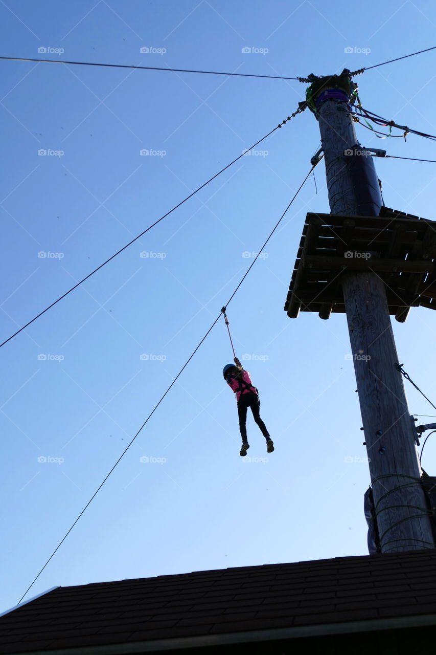 a girl glides with a cable