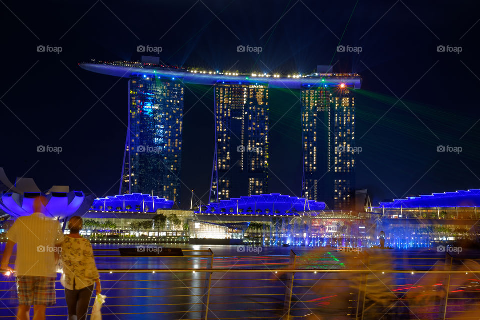 Colours of the Night: Couple watching the laser light show at Marina Bay, Singapore