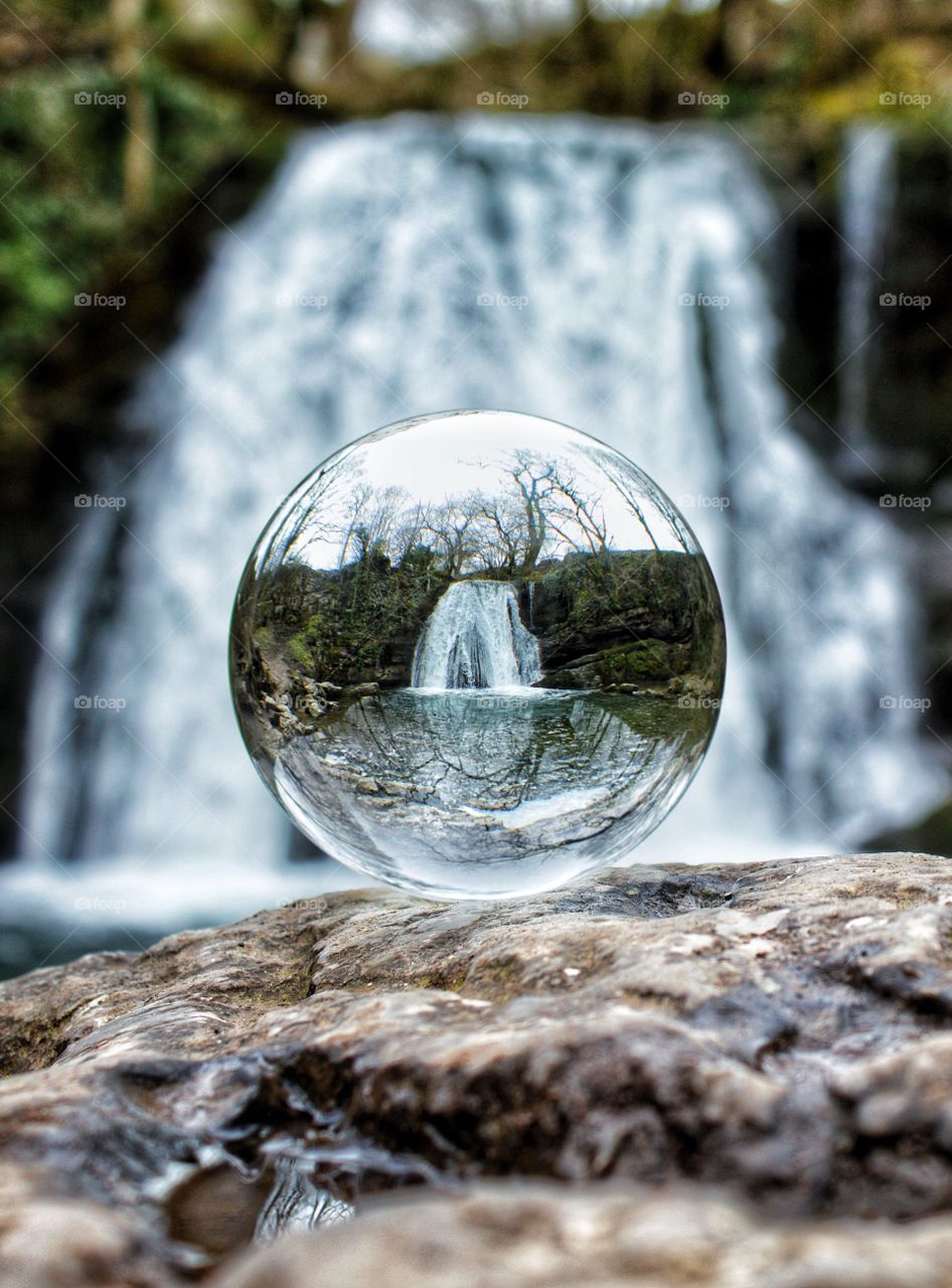 Crystal ball view of Janet’s Foss Waterfall, Yorkshire Dales, UK 