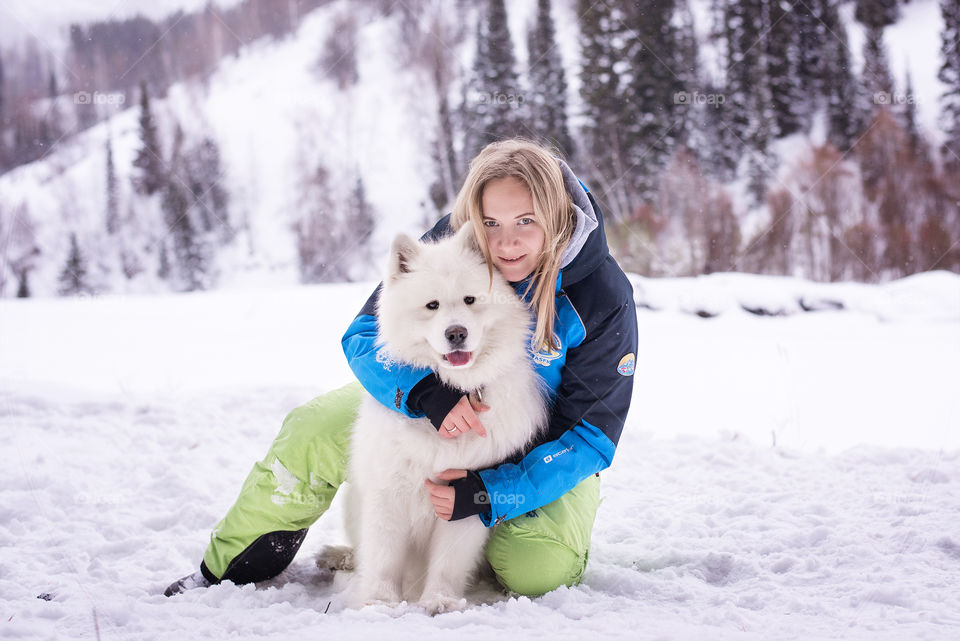Dog and woman in snowy land