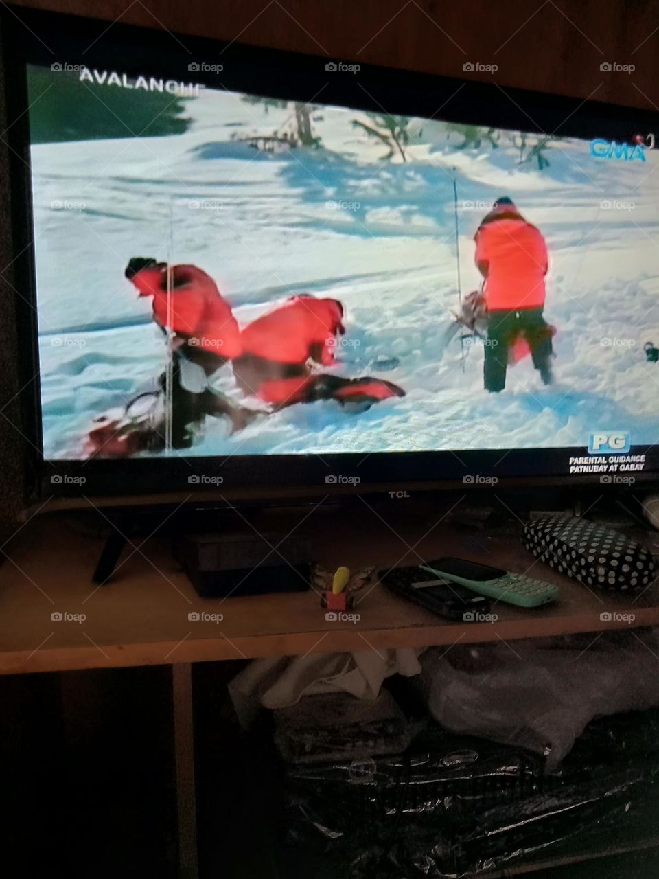 WATCHING MOVIE, AVALANCHE,, IN THE SCENE SHOWN SOME RESCUERS ARE DIGGING, SEARCHING FOR SOME VICTIMS SURVIVORS AFTER THE AVALANCHE