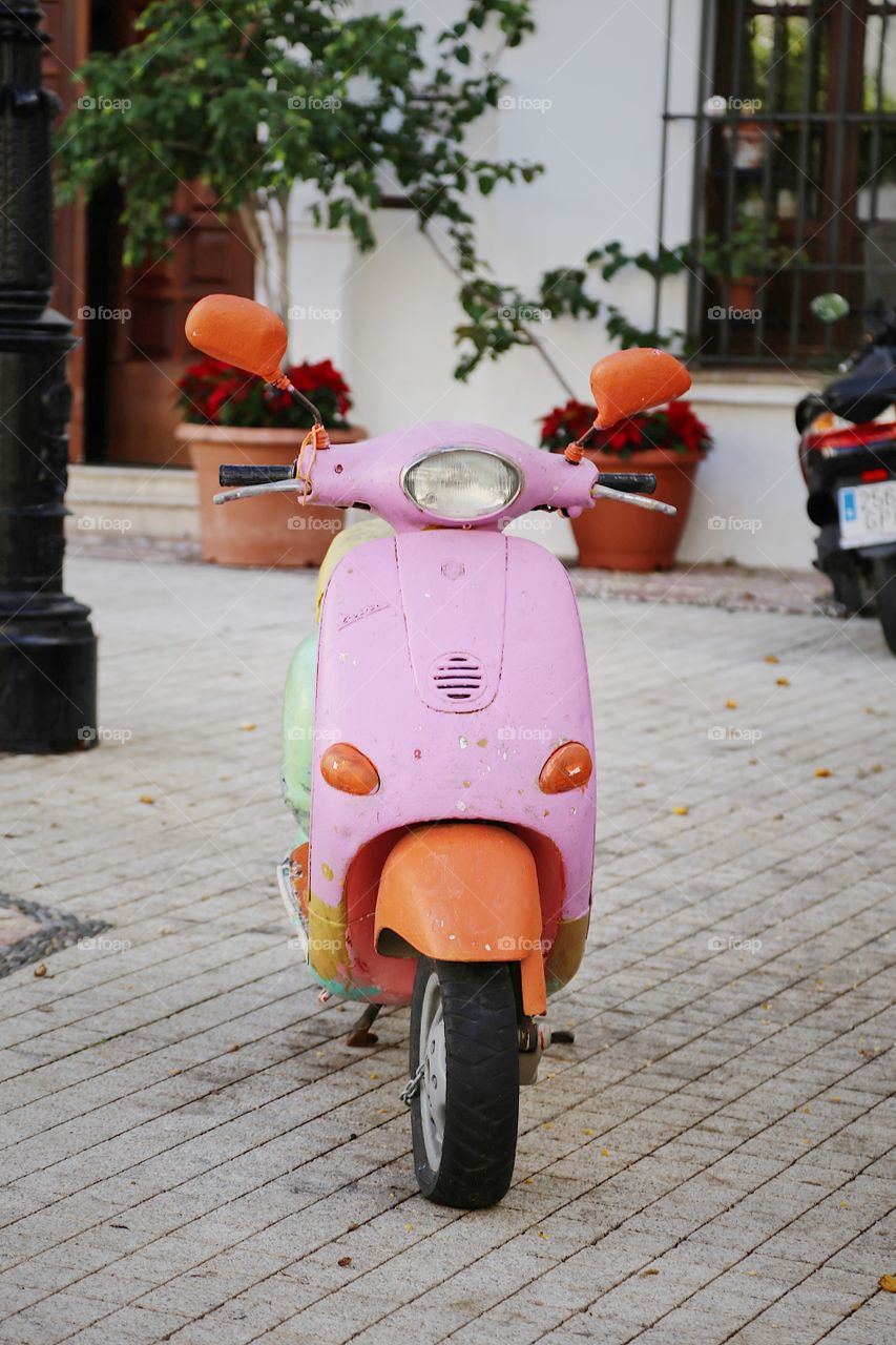 Pink colored scooter