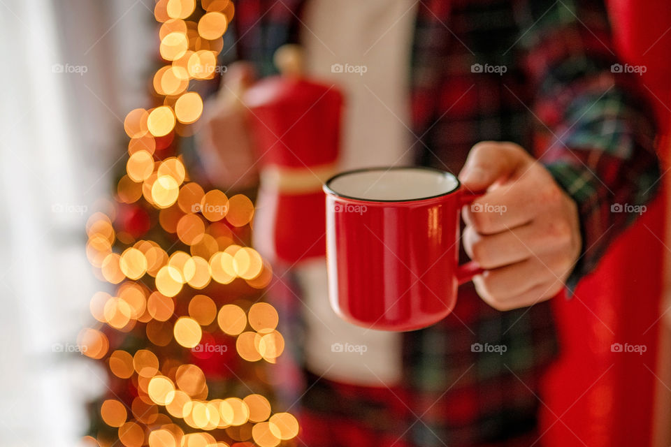 cup of coffee in a cozy festive Christmas atmosphere