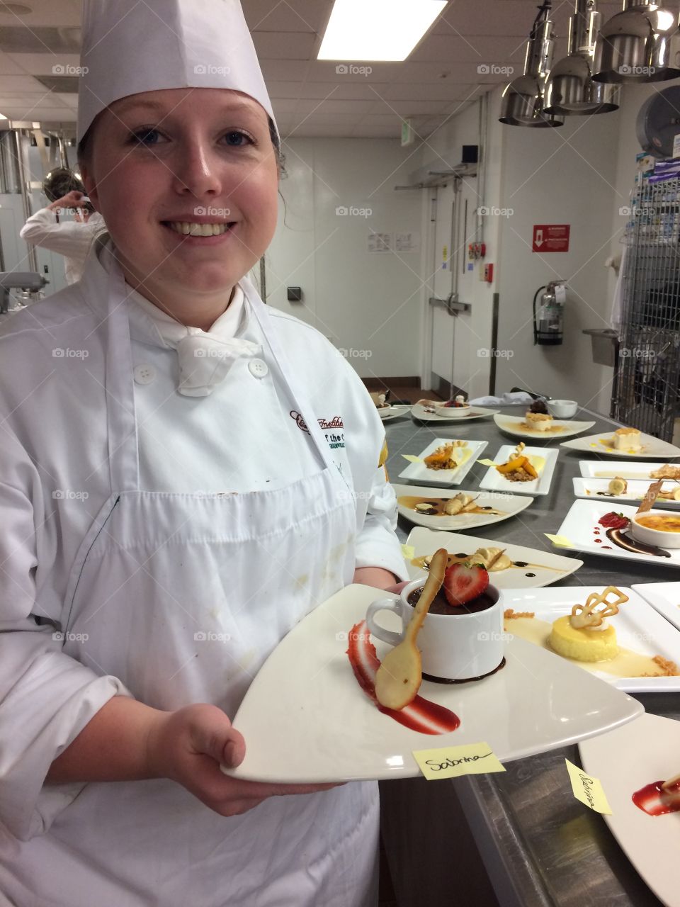 Chef holding delicious food plate in hand