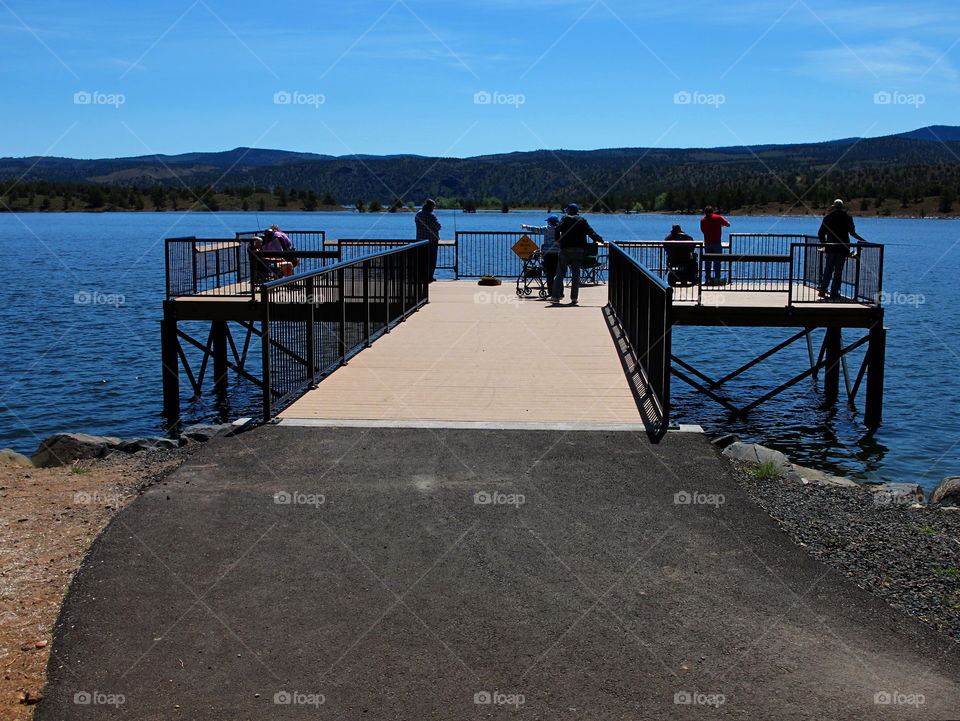 A specially built dock is full of grateful fishermen. 