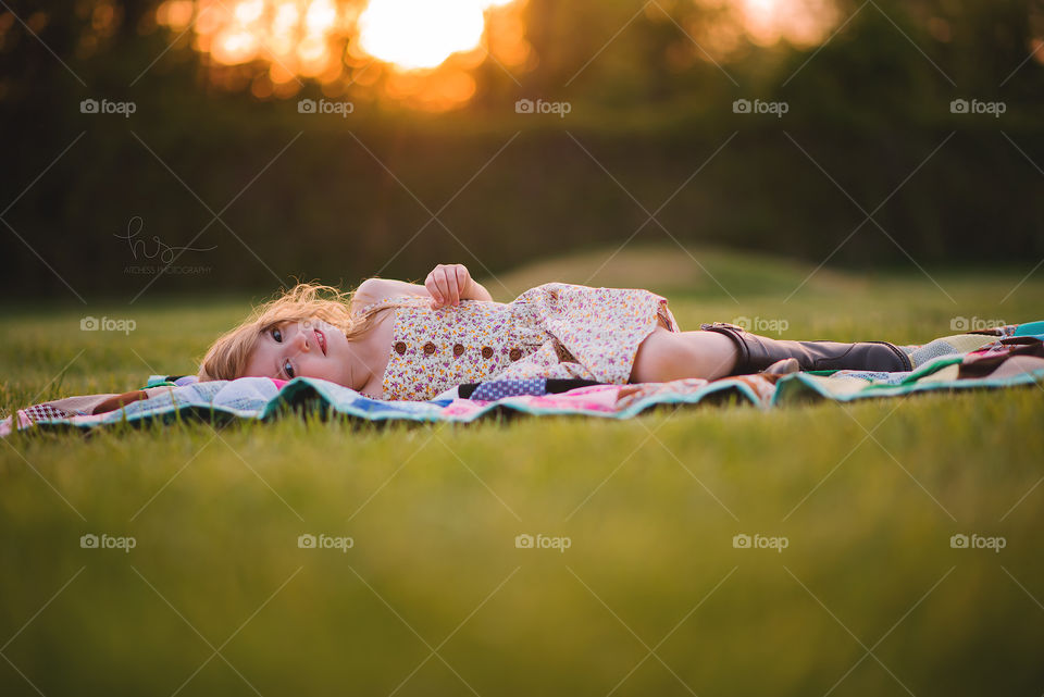 Girl laying on blanket