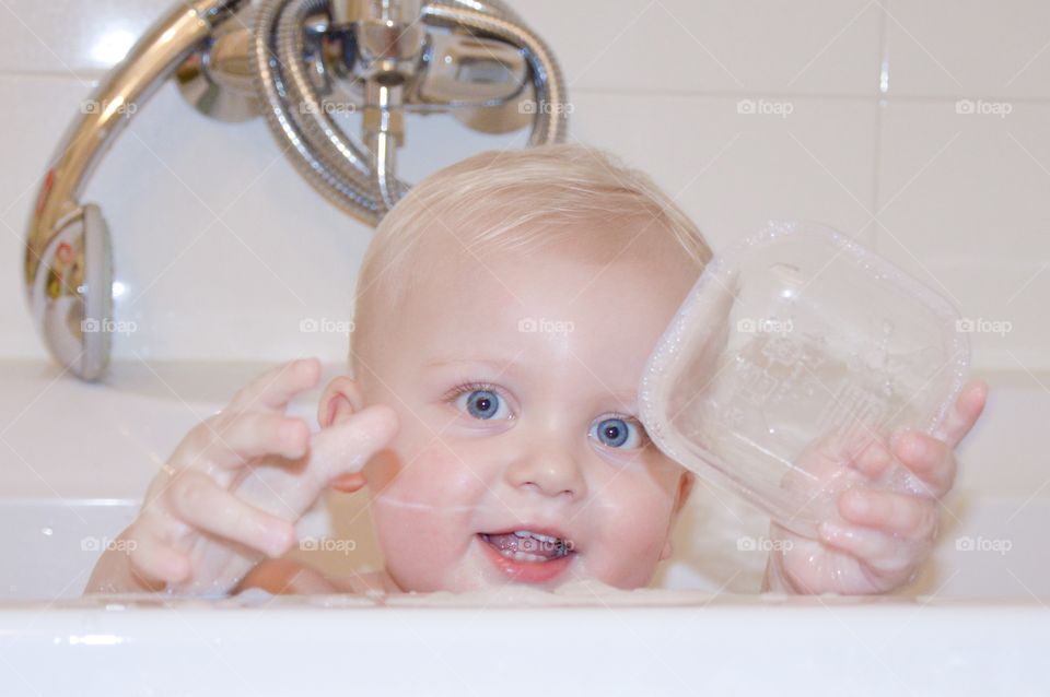 Baby playing in bath