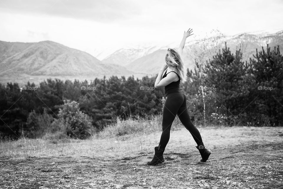 girl dancing on the mountain