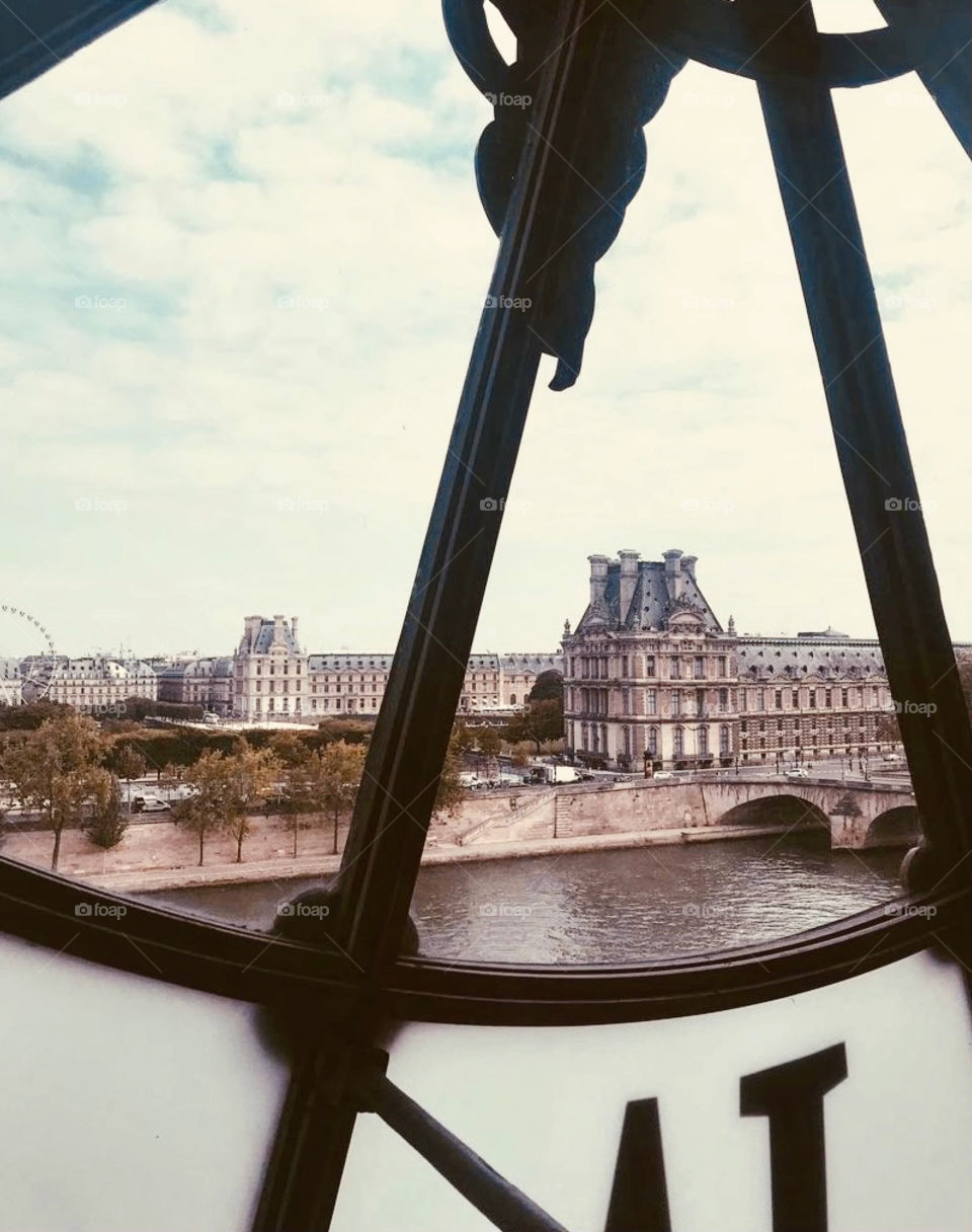 Peeking out of clock at the top  of Musée d'Orsay for a beautiful for a unique view of Paris