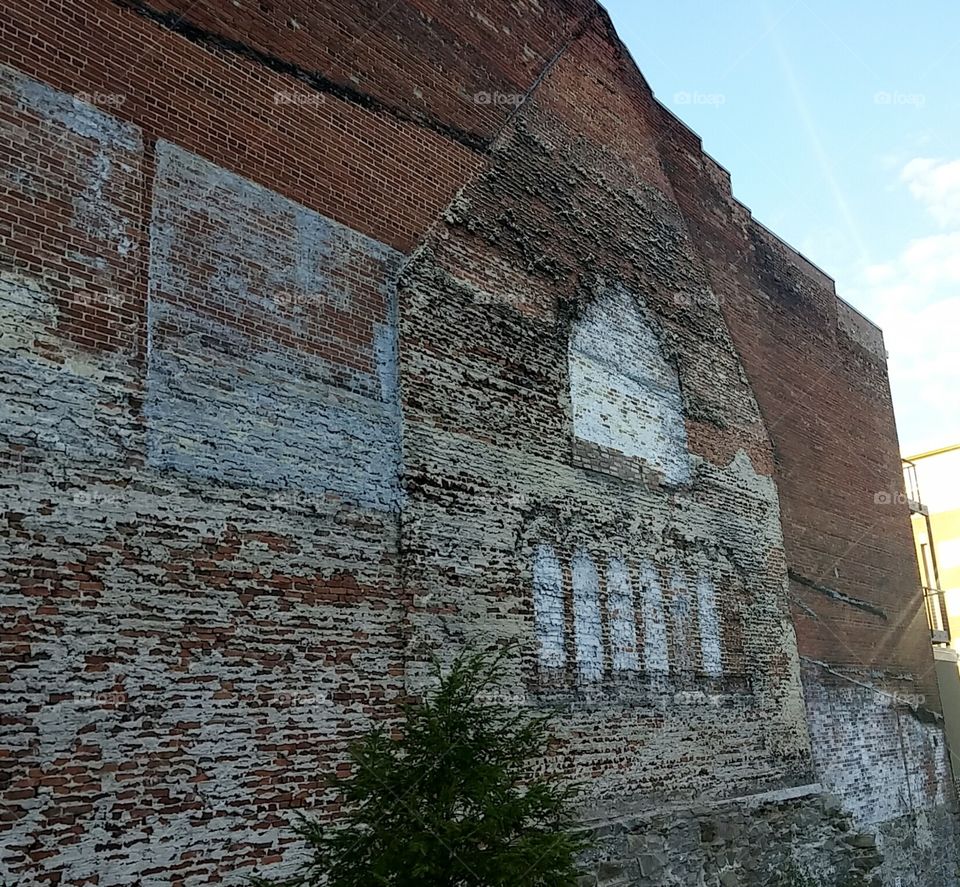 house outline on brick wall