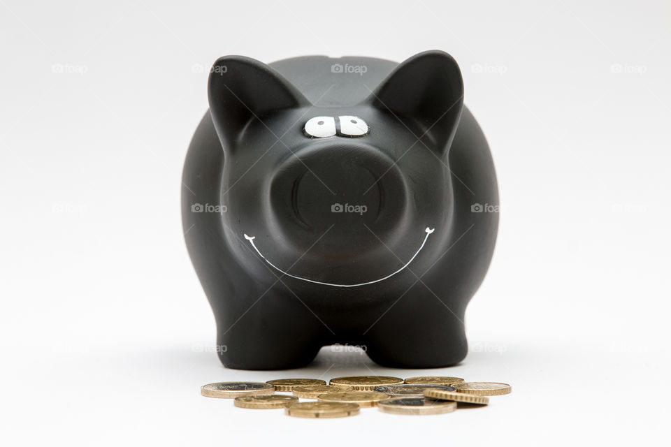 Black Piggy Bank With Coins, Isolated In White Backgound