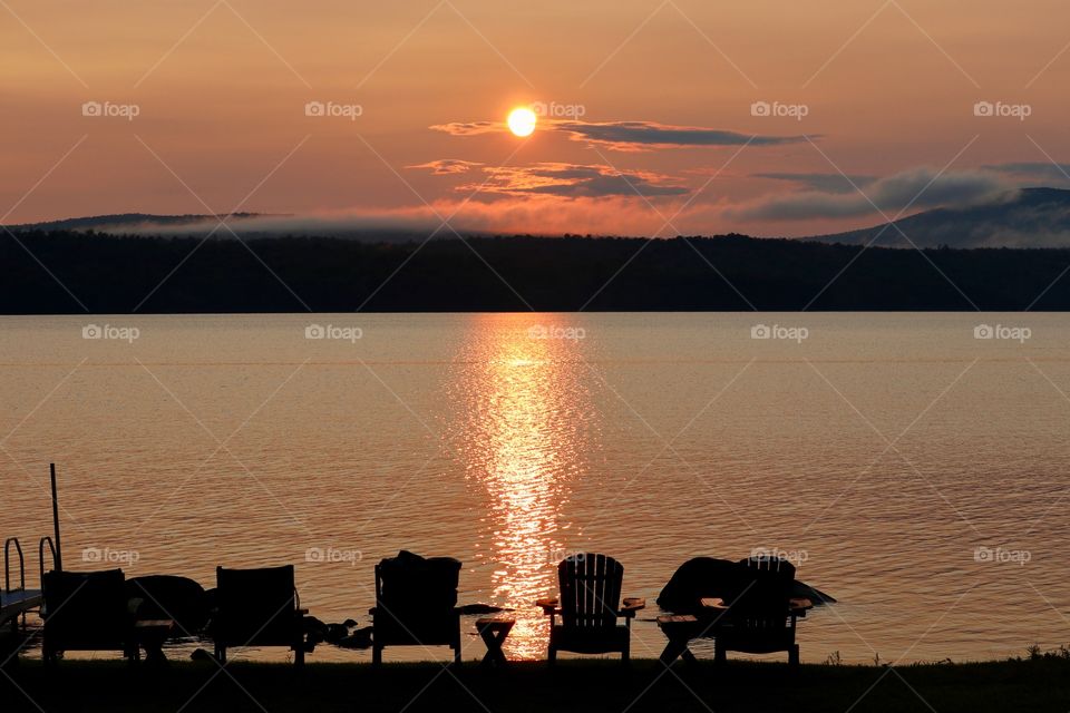 Fiery sunset at the lake in the Adirondack mountains 