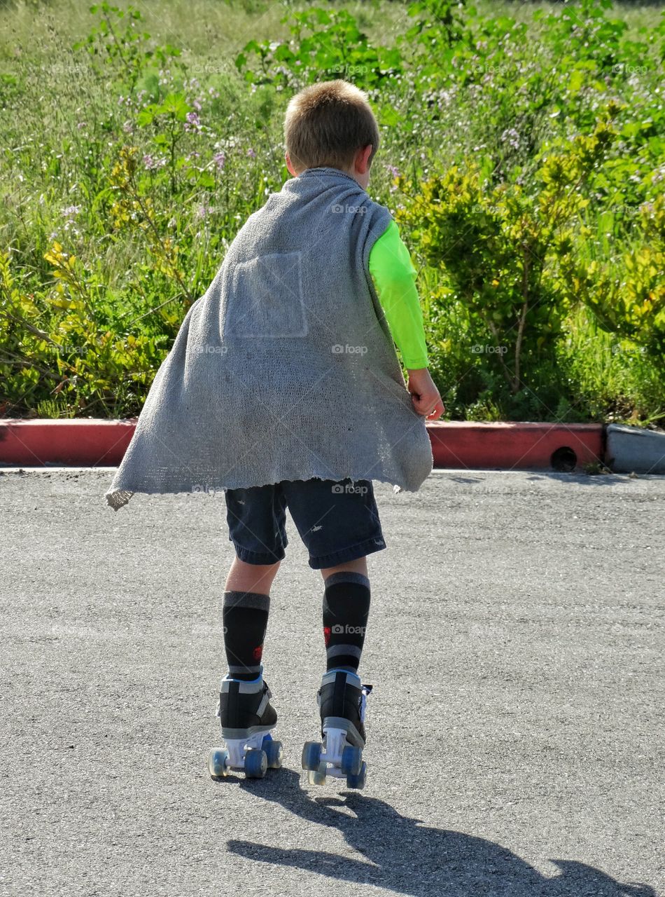 Young Boy On Roller Skates
