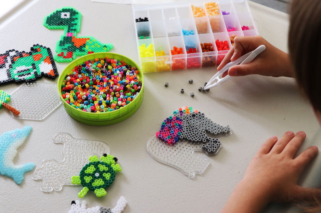 Child creating Fuse Bead picture