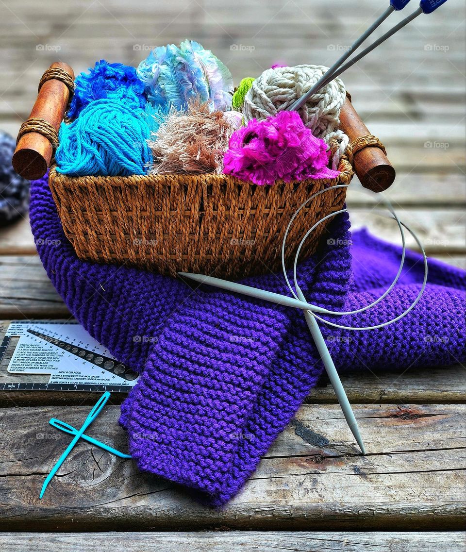 Basket of colorful knitting supplies