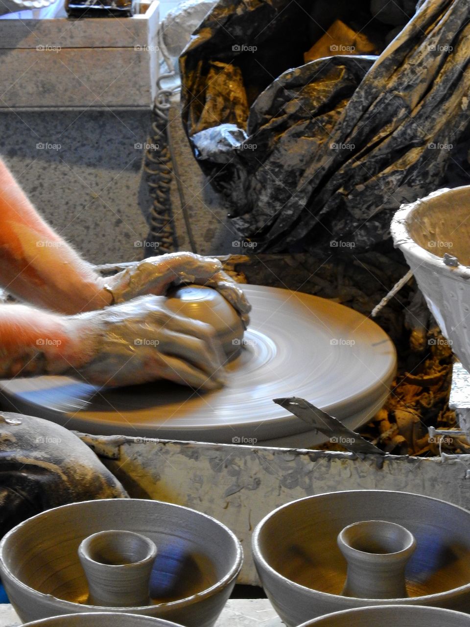 Close-up of person making pottery