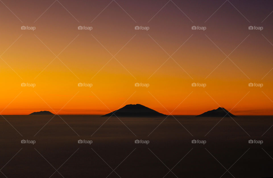 Three mountains between clear mornings
