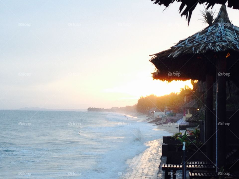 Sunset on the beach . What a relaxing time - when the sun goes down on the horizon, pastell colours, soft, still warm...