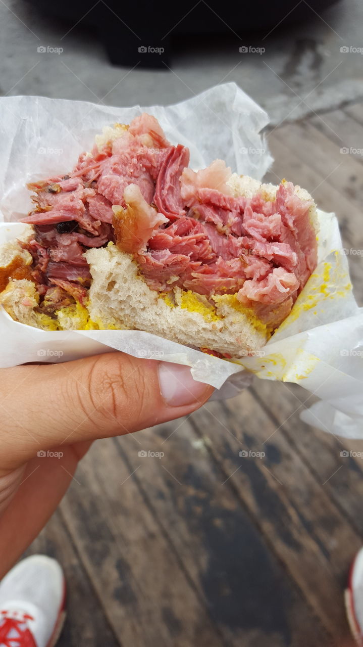 The magic of Montreal smoked meat sandwiches. Juicy meat combined with tangy mustard creates a delicious treat for your senses.