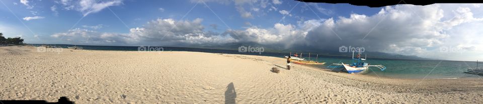 Shadow in the beach with sky and clouds