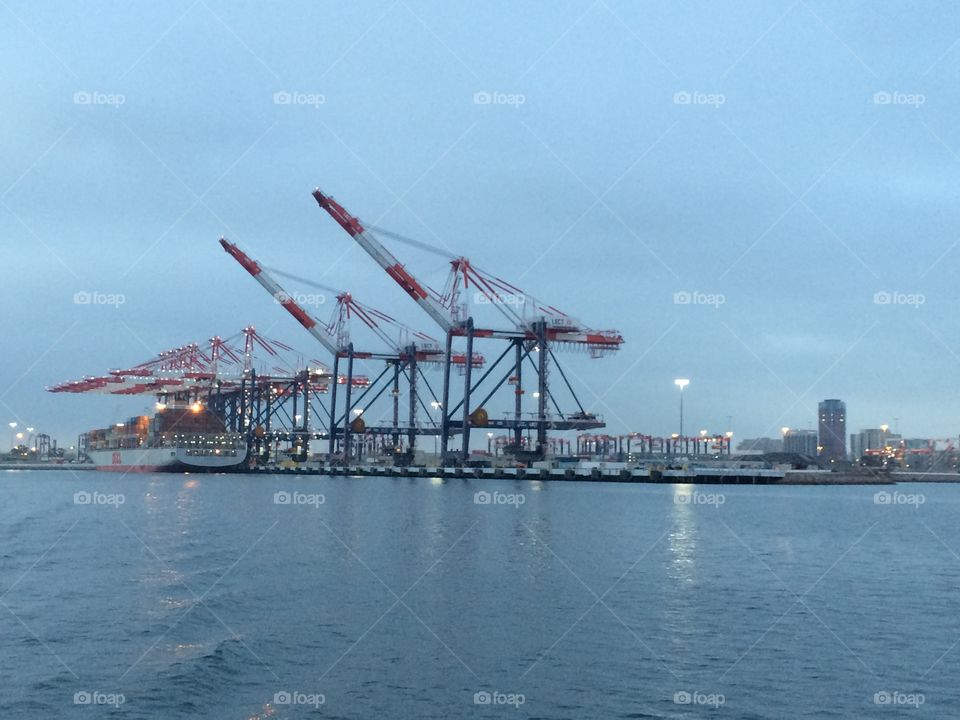 Port of Long Beach cargo ship and cranes 