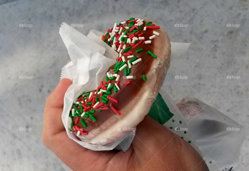 Woman hand holding donut