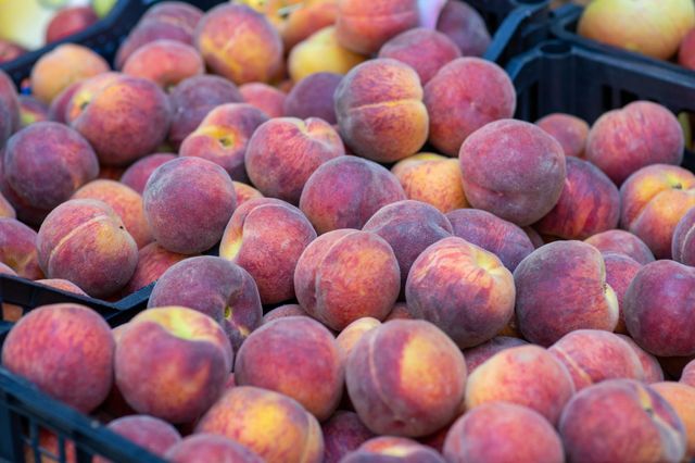 fresh peaches on a market stall