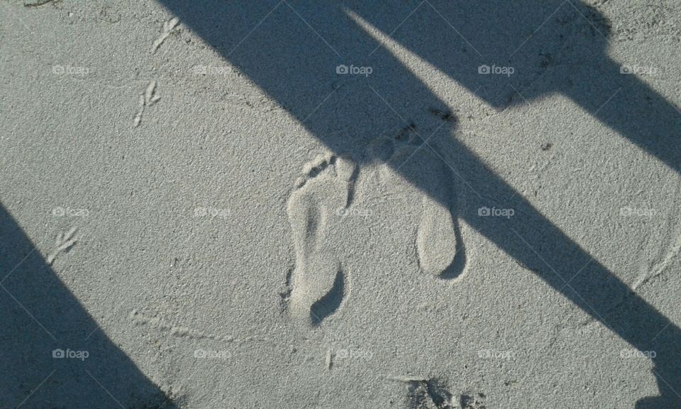 footprints in the sand. sand in my toes..