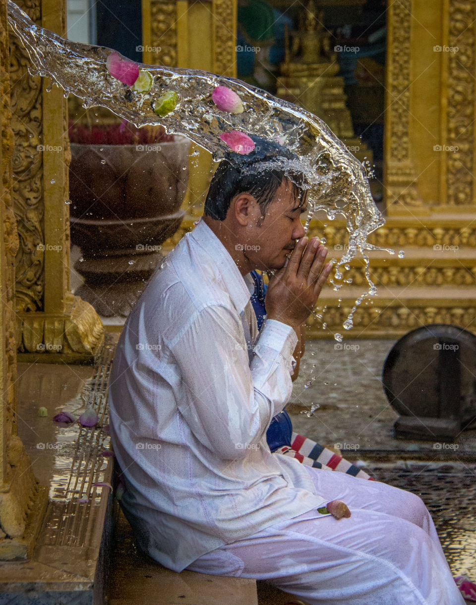 Cleansing ceremony at a temple in Cambodia