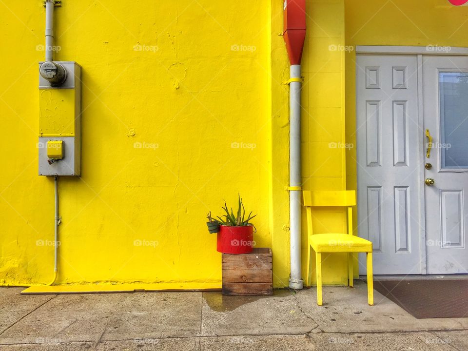 Corner store painted yellow