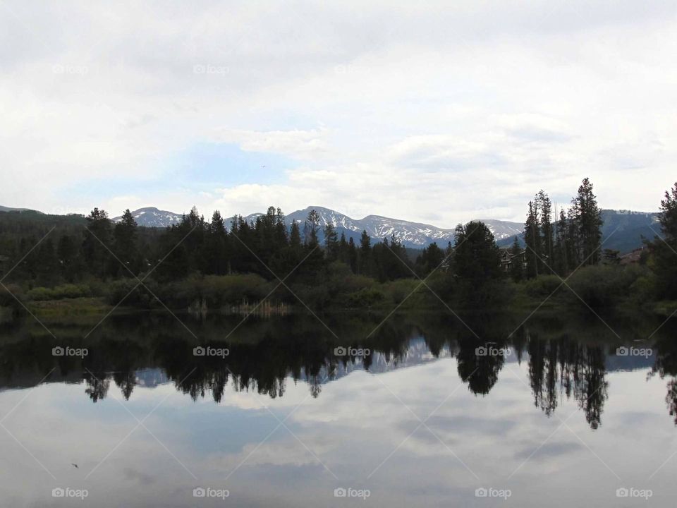 Mountain and tree reflection in this peaceful lake