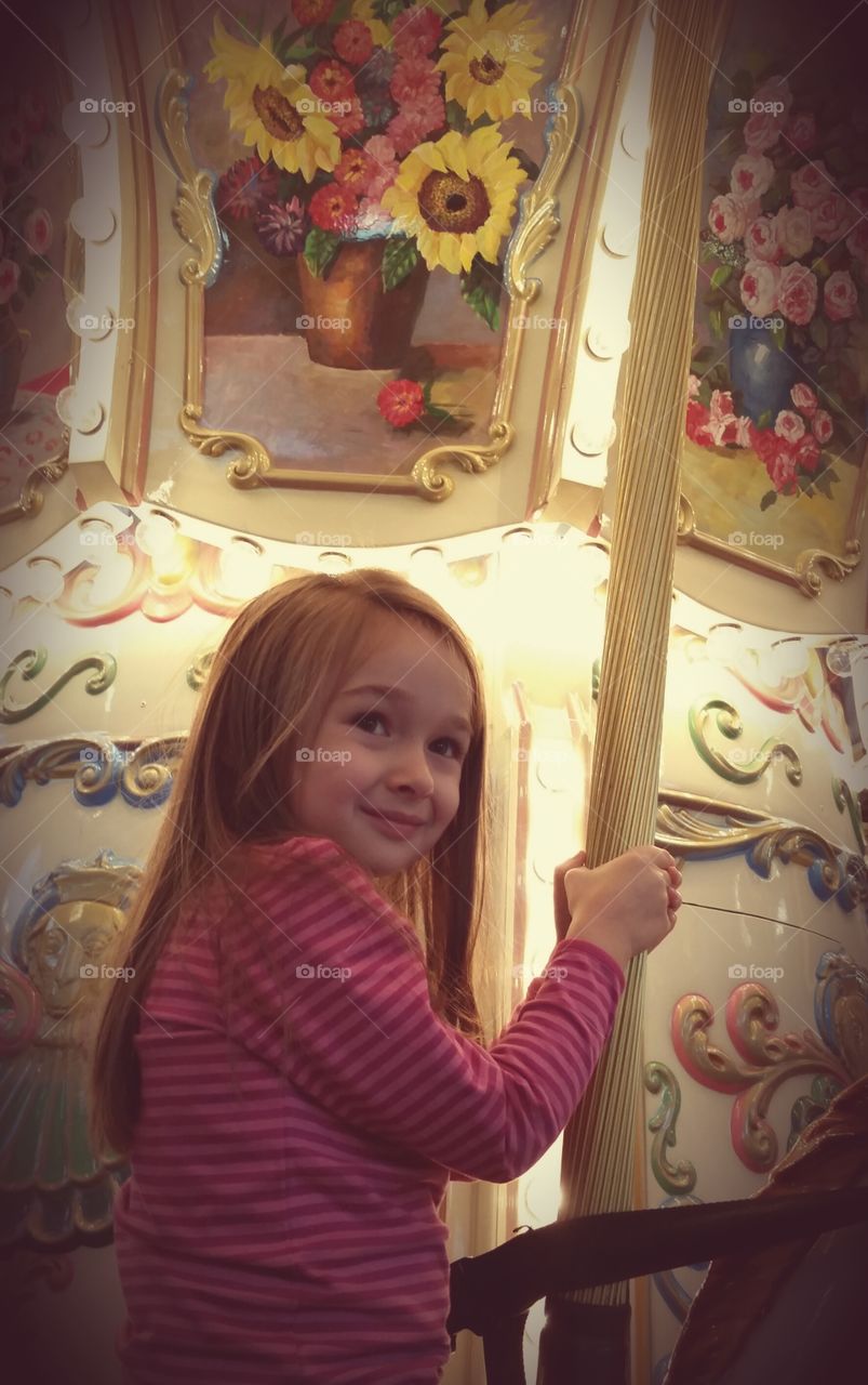 Carousel Ride. My daughter riding the carousel.  