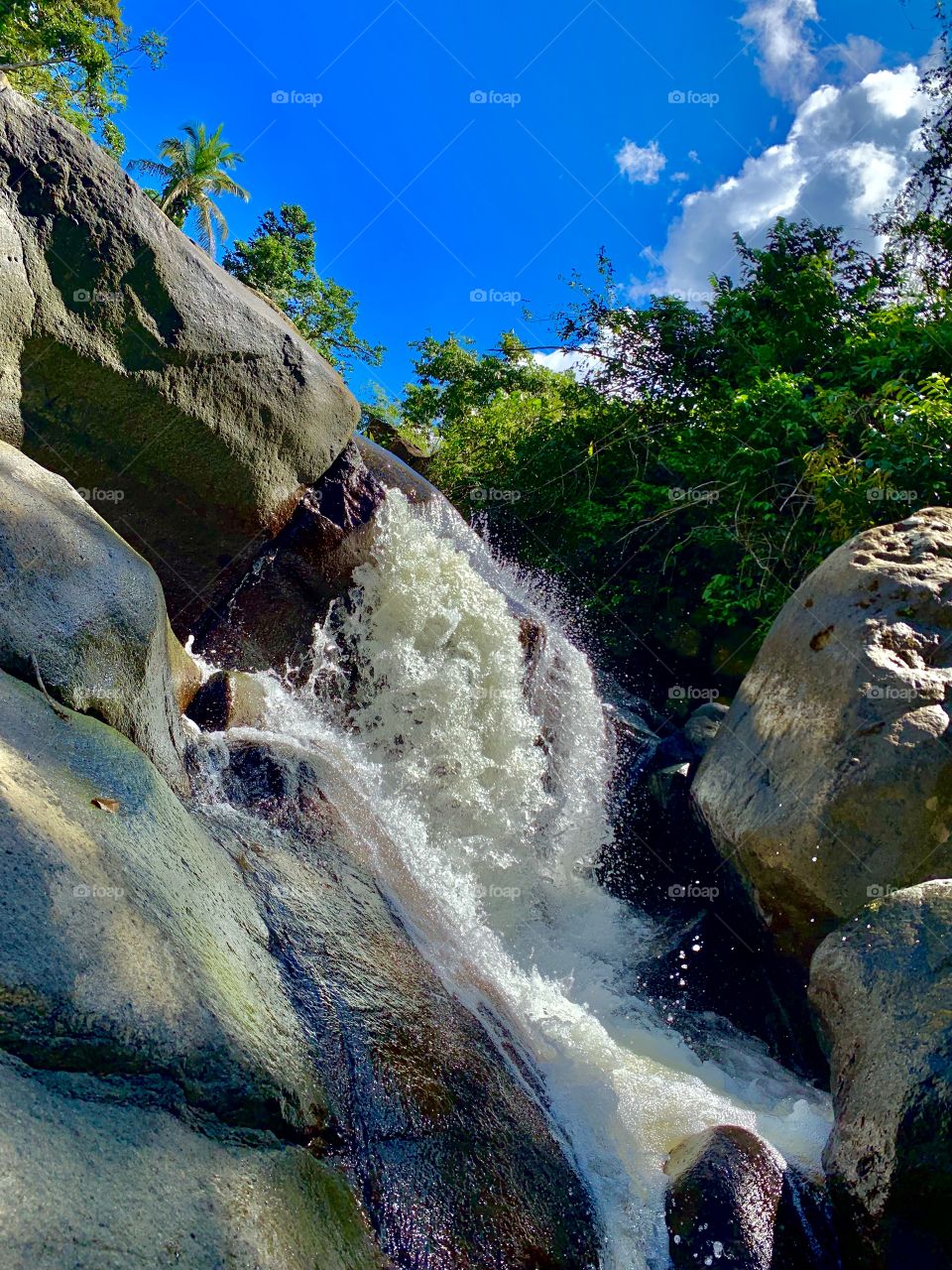 The natural beauty of the rainforest in Puerto Rico as the water creates its own natural slides 