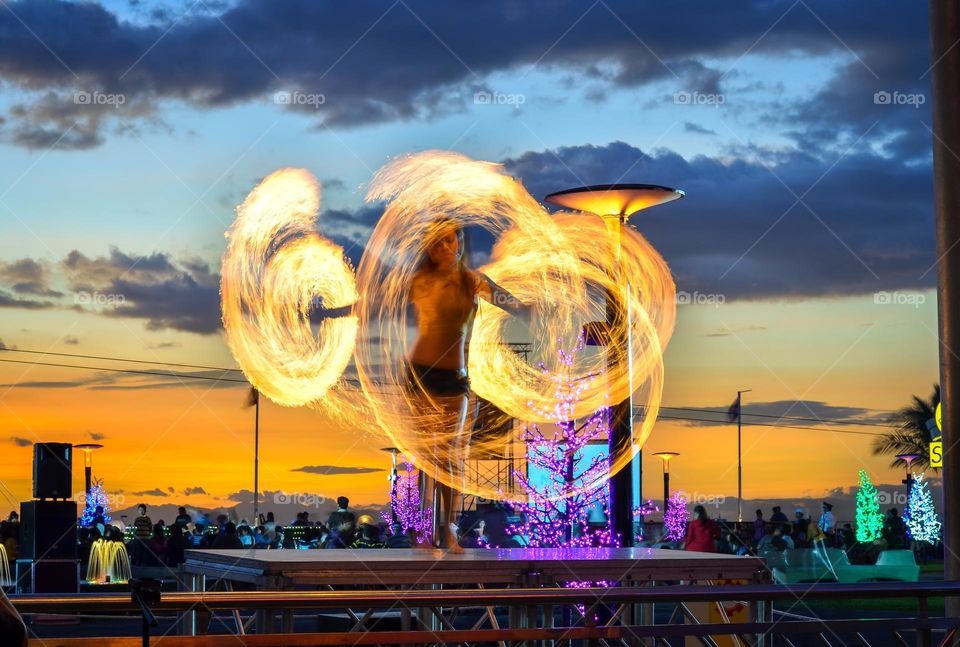 fire dance on a sunset