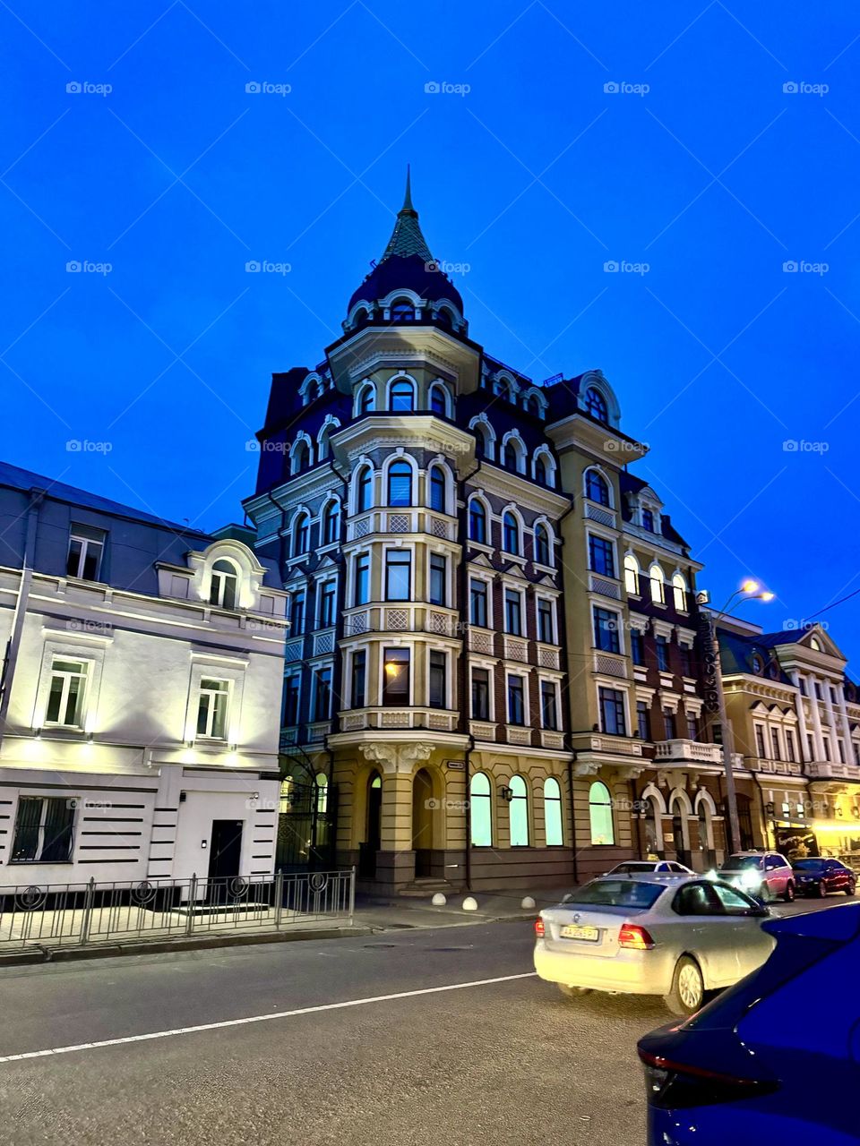 Evening Kyiv with cozy streets with luminous windows