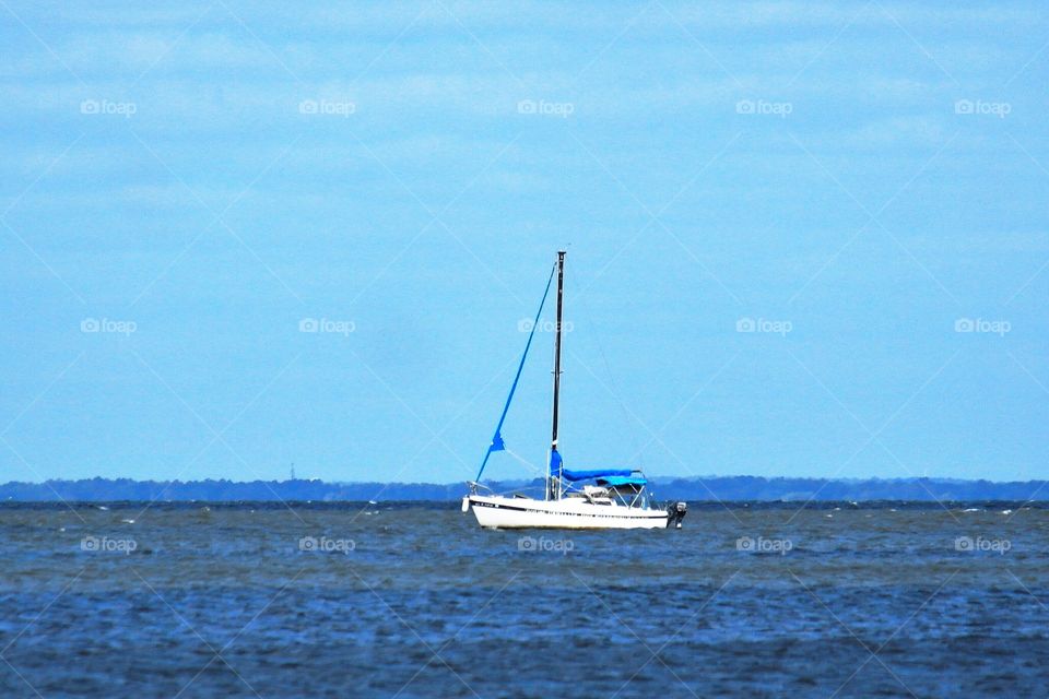 Sailboat in calm bay waters 