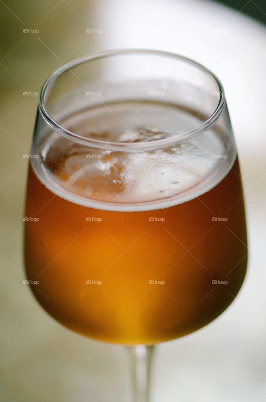 A closeup of a cold glass of beer.
