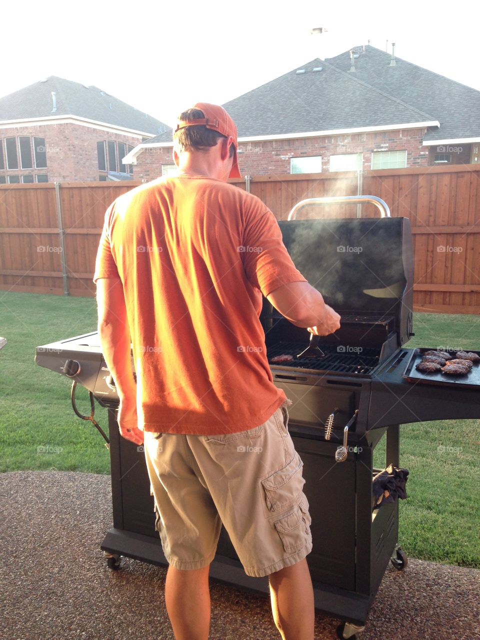 He's SMOKIN'. Man grilling 