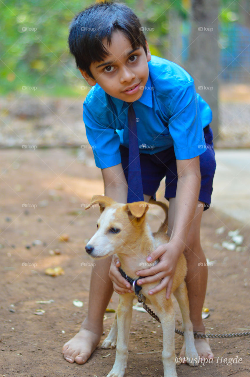 Boy and puppy.