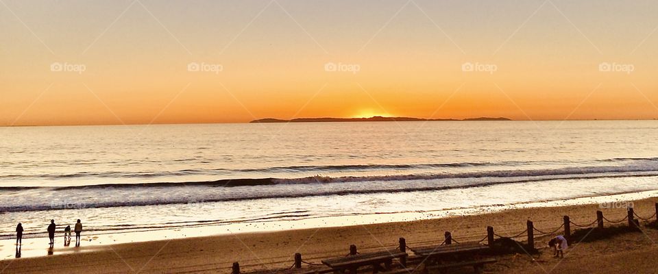 Foap Mission Light Natural vs. artificial vol. 2! Silhouettes of People on the Beach watching California Sunset Over Catalina Island.