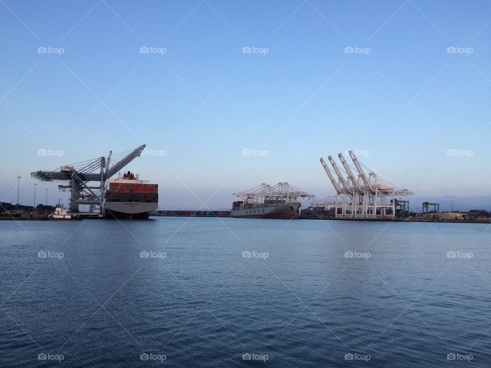 Port of Long Beach cargo ship and cranes 