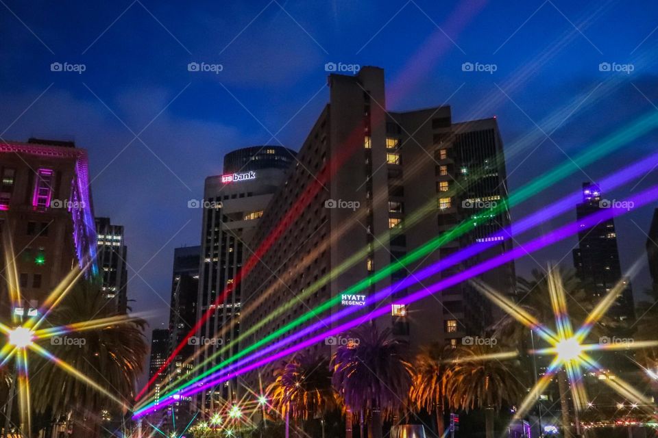 Light display for San Francisco Pride 2023 projecting the colors of the Pride Rainbow Flag down Market Street from the Ferry Building on the Embarcadero