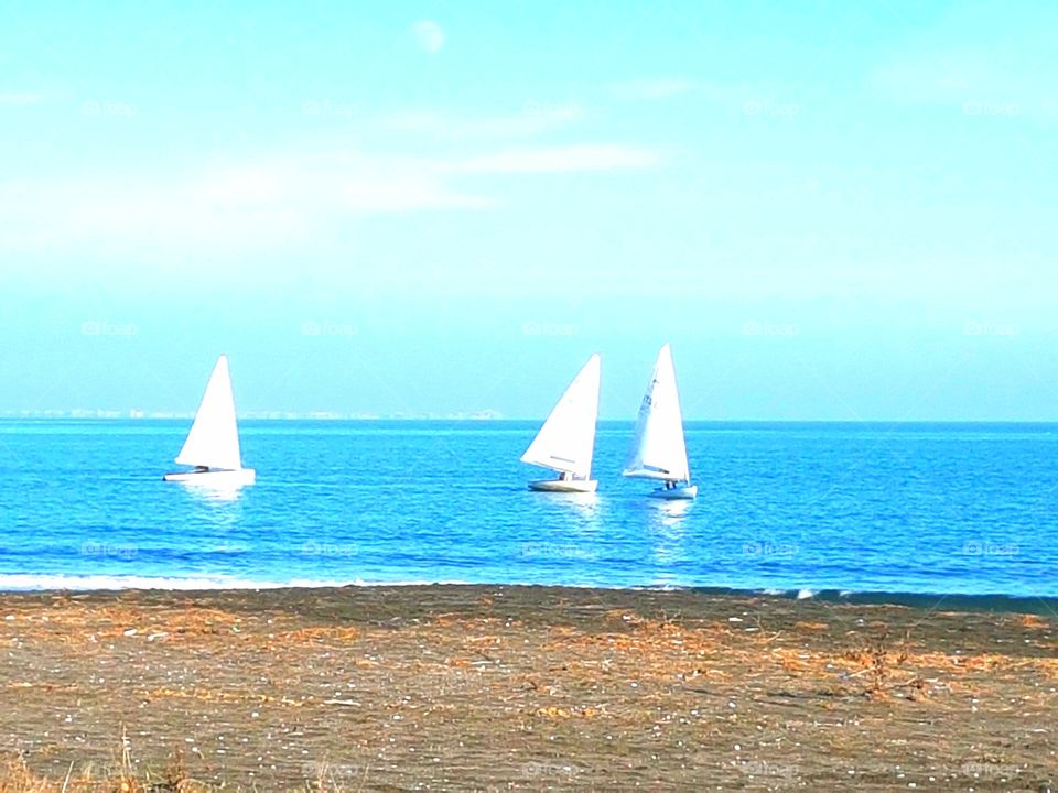 Three boats in the sea