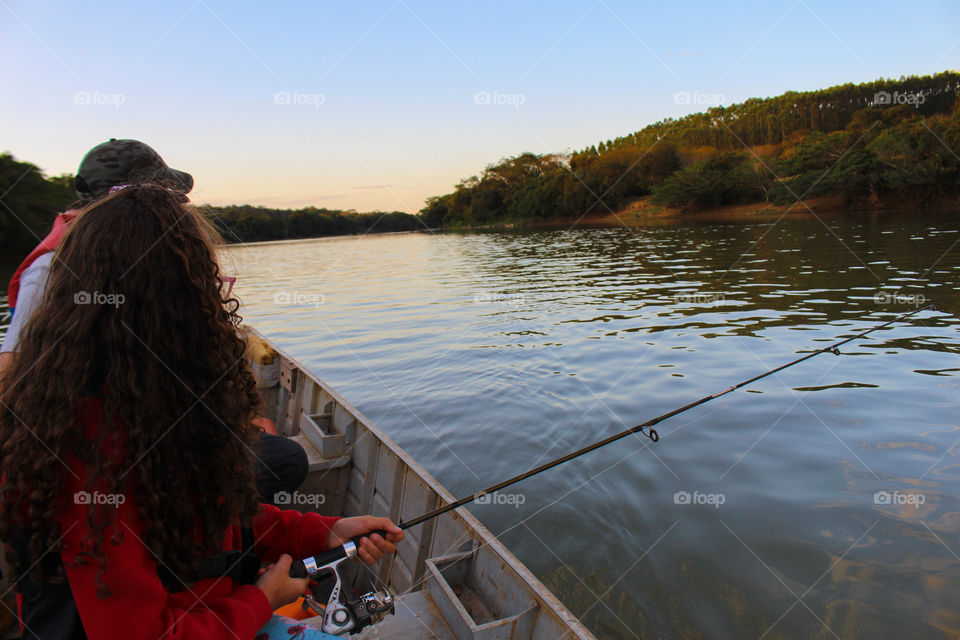 Family fishing in the river