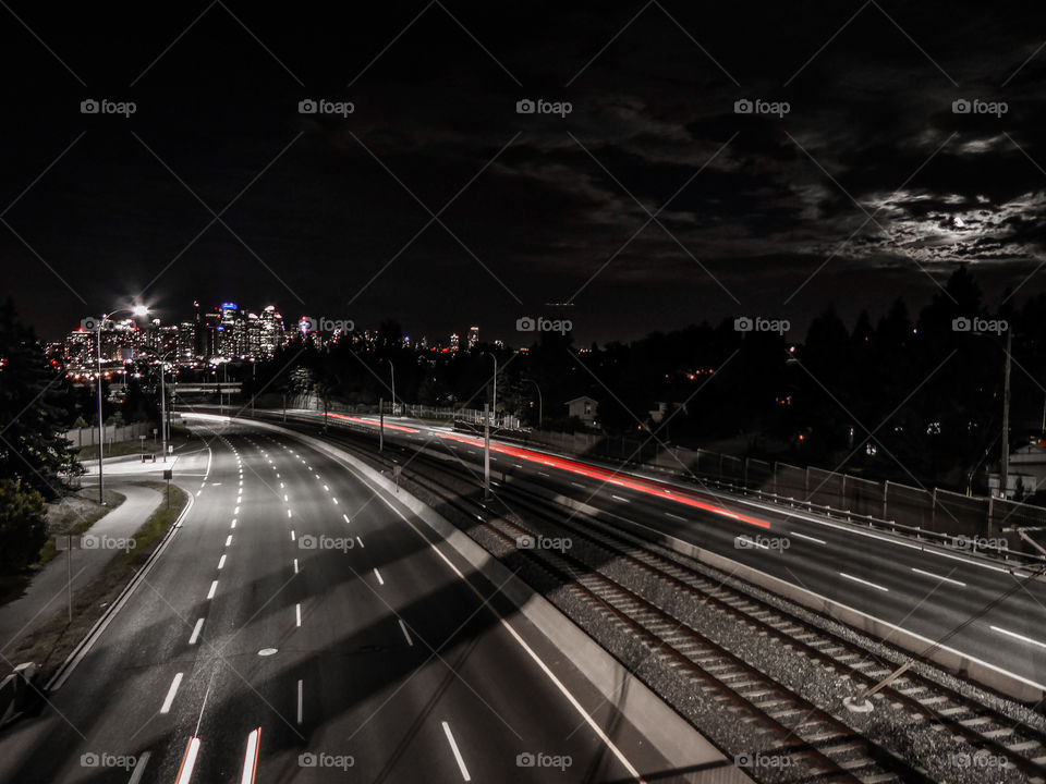 Calgary skyline as cars pass by late at night. Shot on Lumix Camera