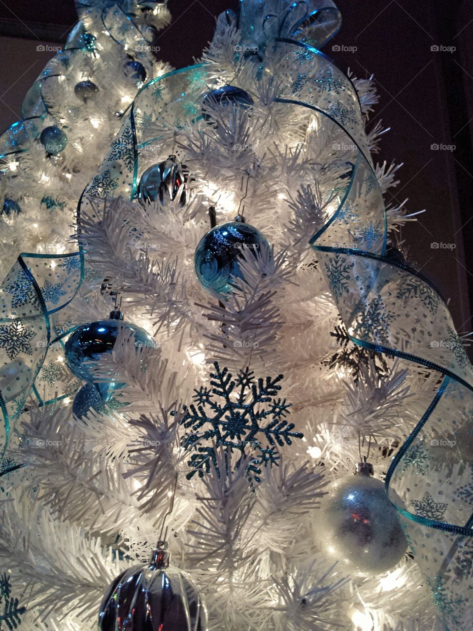 White Christmas tree with blue and silver decoration